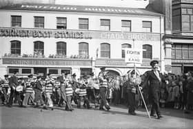 1950s... The Long Tower Carnival passes the Corner Boot Stores at Waterloo Street which was owned by the Chada family.