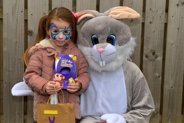Four-year-old Lola Cullen pictured with the Easter Bunny at the Glenabbey Easter Party held in the Radius Housing Hub on Thursday afternoon last. DER2215GS – 029