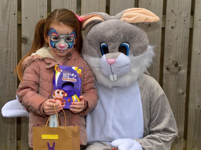 Four-year-old Lola Cullen pictured with the Easter Bunny at the Glenabbey Easter Party held in the Radius Housing Hub on Thursday afternoon last. DER2215GS – 029