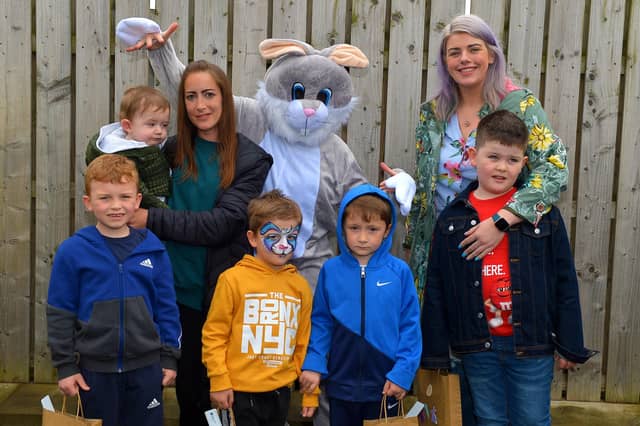 The Griffin and O’Doherty families pictured with the Easter Bunny at the Glenabbey Easter Party held in the Radius Housing Hub on Thursday afternoon last. DER2215GS – 034