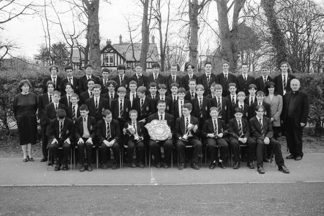 St. Columb’s College orchestra, winners of the Post-Primary School Orchestra at Feis Doire Colmcille. The school also won the Bishop’s Shield for the school with the most marks at the Feis. Included are, standing left, Sr. Perpetua and, standing right, Margaret Ross, and Fr. John Walsh, school president.