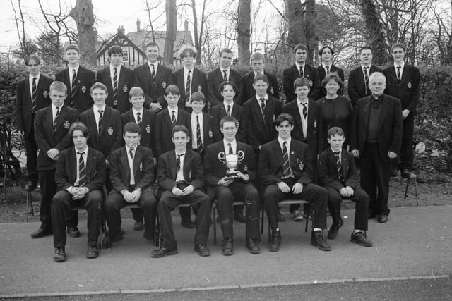 St. Columb’s College senior choir, winners of the Sacred Music Post-Primary and Youth Choir Under-19 at Feis Doire Colmcille. Included are music teacher Sr. Perpetua and Fr. John Walsh, school president.