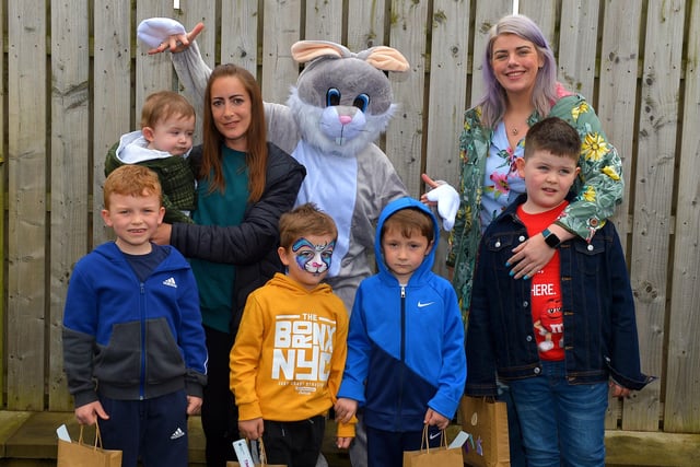 The Griffin and O’Doherty families pictured with the Easter Bunny at the Glenabbey Easter Party held in the Radius Housing Hub on Thursday afternoon last. DER2215GS – 034