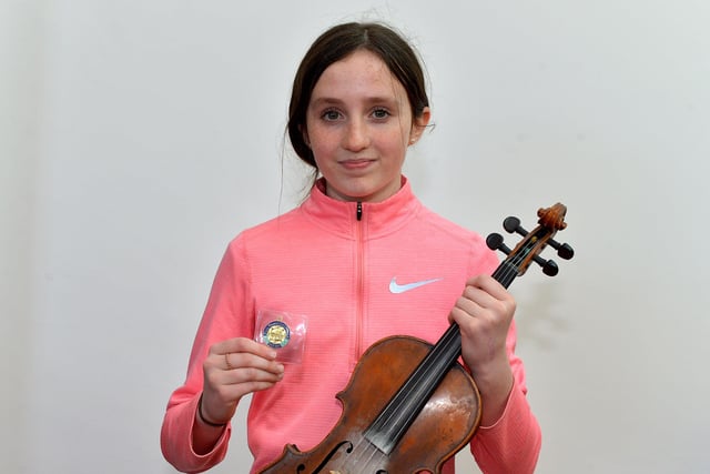 Eadaoin OHagan achieved first place Fiddle age 12 to 15 at the Féis Dhoíre Cholmcílle, held in Millennium Forum. DER2216GS  061