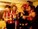 Derry City’s Liam Coyle, Declan Boyle, Declan Devine, Paul Curran, Peter Hutton and John Pio O’Doherty (fan) celebrate the 1997 title triumph.