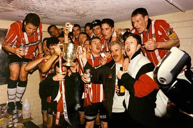 Derry City celebrate their 1997 League of Ireland title glory in the Brandywell changing room.