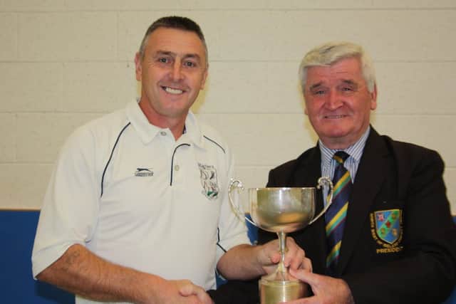 Connie McAllister, North West Cricket Union President, presents the Q4 league trophy to Maghera captain, Alfie Stewart in 2017.