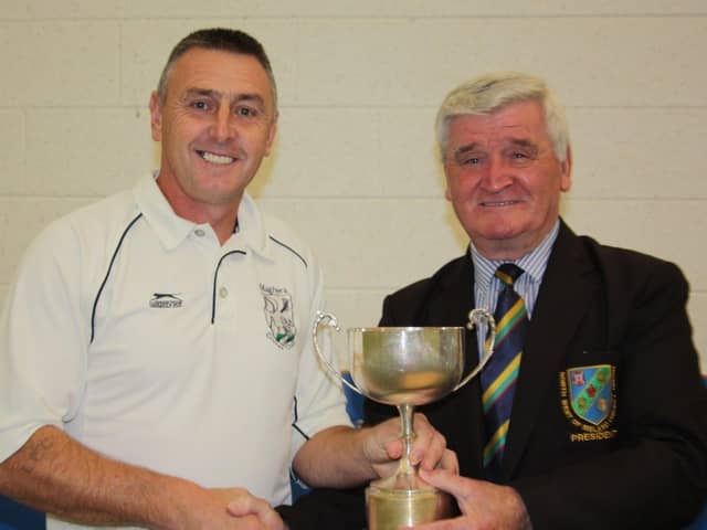 Connie McAllister, North West Cricket Union President, presents the Q4 league trophy to Maghera captain, Alfie Stewart in 2017.