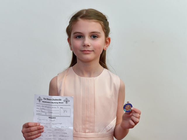Angel McMonagle achieved second place P4 Girls Verse at the Feis Doire Colmcille, held in Millennium Forum. DER2216GS  105