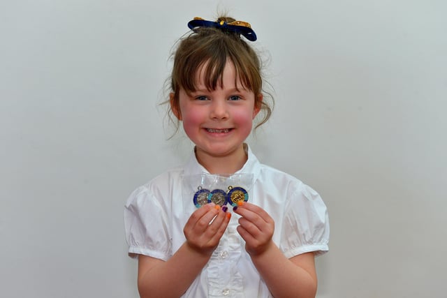 Niamh Moore achieved first place Childrens Irish Song and second place in Childrens English Song and Light Jig Bun-Grad at the Féis Dhoíre Cholmcílle, held in Millennium Forum. DER2216GS  137