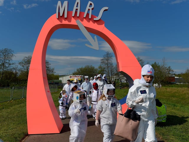 People arrive at Bay Road Park, on Saturday morning, to take part in a successful world record attempt for the most people dressed as astronauts in one place. Photo: George Sweeney. DER2216GS – 208