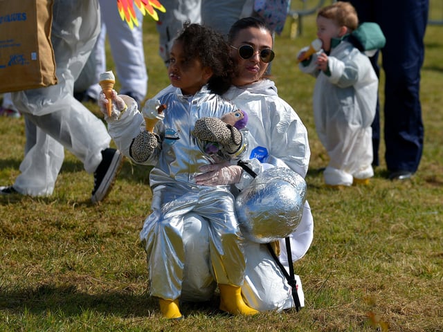 Enjoying an ice cream in Bay Road Park, on Saturday morning, before the successful world record attempt for the most people dressed as astronauts in one place. Photo: George Sweeney. DER2216GS – 203