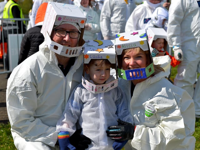 A family at Bay Road Park, on Saturday morning, to take part in a successful world record attempt for the most people dressed as astronauts in one place. Photo: George Sweeney. DER2216GS – 206