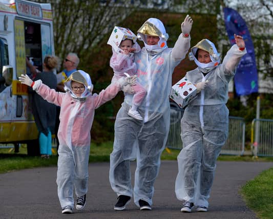 People arrive at Bay Road Park, on Saturday morning, to take part in a successful world record attempt for the most people dressed as astronauts in one place. Photo: George Sweeney. DER2216GS – 190
