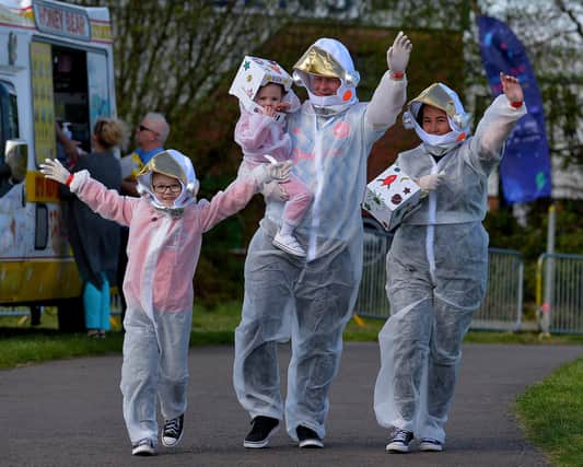 People arrive at Bay Road Park, on Saturday morning, to take part in a successful world record attempt for the most people dressed as astronauts in one place. Photo: George Sweeney. DER2216GS – 190