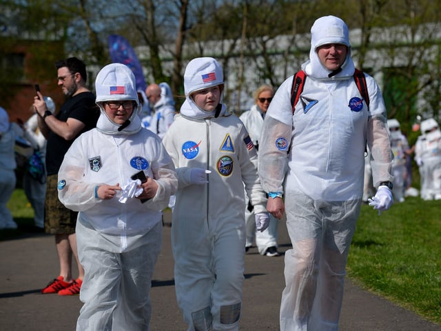 People arrive at Bay Road Park, on Saturday morning, to take part in a successful world record attempt for the most people dressed as astronauts in one place. Photo: George Sweeney. DER2216GS – 195