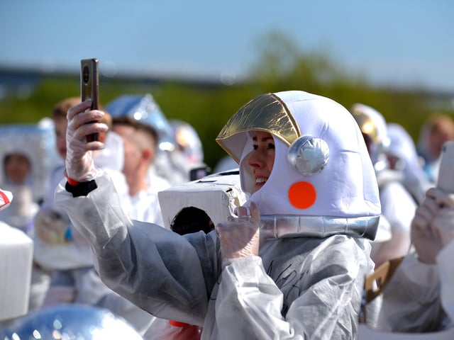 Enjoying the fun and sun in Bay Road Park, on Saturday morning, before the count for the world record attempt for the most people dressed as astronauts in one place. Photo: George Sweeney. DER2216GS – 209