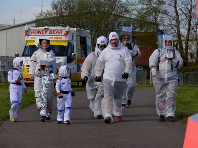 Families arrive at Bay Road Park, on Saturday morning, to take part in a successful world record attempt for the most people dressed as astronauts in one polace. Photo: George Sweeney. DER2216GS – 192
