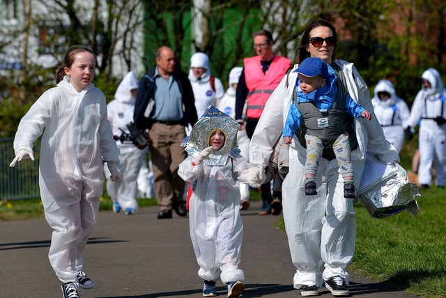 A family arrives at Bay Road Park, on Saturday morning, to take part in a successful world record attempt for the most people dressed as astronauts in one place. Photo: George Sweeney. DER2216GS – 194