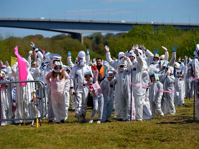 Some of the 718 record breakers who took part in the successful world record attempt for the most people dressed as astronauts in one place celebrate at the official count announcement. The previous record was 257 held by a school in England. Photo: George Sweeney. DER2216GS – 216