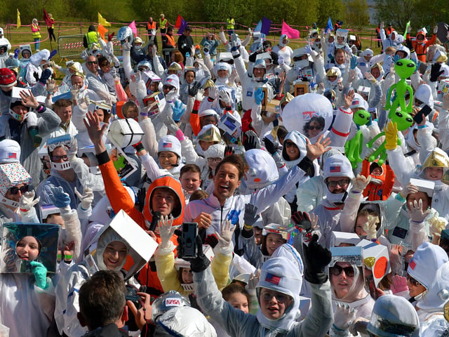 Some of the 718 record breakers who took part in the successful world record attempt for the most people dressed as astronauts in one place celebrate at the official count announcement. The previous record was 257 held by a school in England. Photo: George Sweeney. DER2216GS – 213