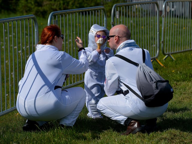 Enjoying an ice cream in Bay Road Park, on Saturday morning, before the successful world record attempt for the most people dressed as astronauts in one place. Photo: George Sweeney. DER2216GS – 200
