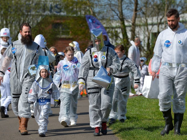 Enjoying an ice cream in Bay Road Park, on Saturday morning, before the successful world record attempt for the most people dressed as astronauts in one place. Photo: George Sweeney. DER2216GS – 202