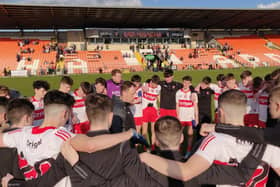 Derry Minor manager Martin Boyle talks to his players after their impressive Ulster CHampionship victory over Armagh in the Athletic Grounds