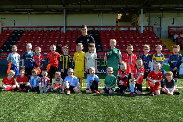Derry City youngster Daithi McCallion pictured with some of the children who attended the Derry City Easter Football Camp at the Brandywell Stadium. Picture: George Sweeney. DER2216GS-070