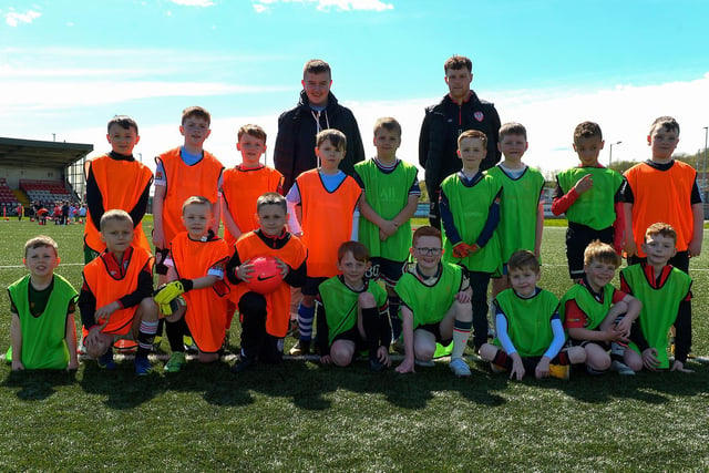 Derry City's Cameron McJannet (standing right) pictured alongside the young footballers who took part in the Derry City Easter Football Camp at the Brandywell Stadium. Picture: George Sweeney. DER2216GS-071
