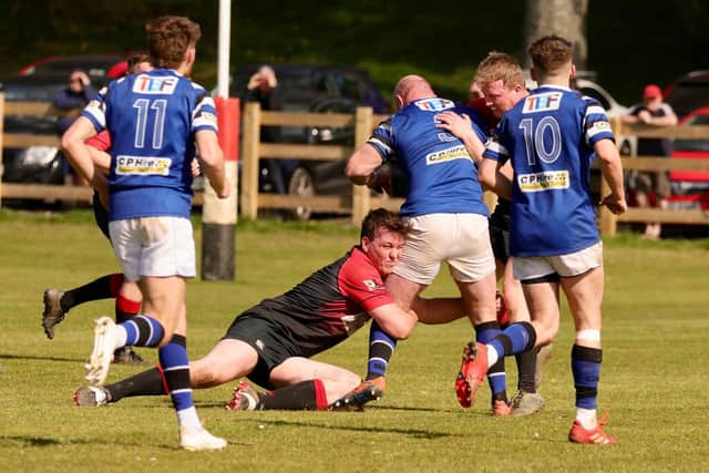 Limavady's Michael Shiels get the tackle in on Coleraine’s Peter Todd during Saturday's dramatic Kukri Ulster Rugby Championship Two Play-off Final. (Photo: Steven Haslett)