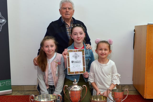 Feis Secretary Pat MacCafferty pictured with Eva Connolly winner of the George White Cup, May Connolly winner of the Jim Chapman Cup and Elowen Connolly winner of the Kathleen Henderson Cup and bursary at the Feis Doire Colmcille, held in Millennium Forum. DER2216GS  119