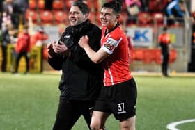 Derry City’s Daithí McCallion and manager Ruaidhrí Higgins celebrate Friday night’s win over UCD. Picture by Kevin Morrison/Event Images & Video