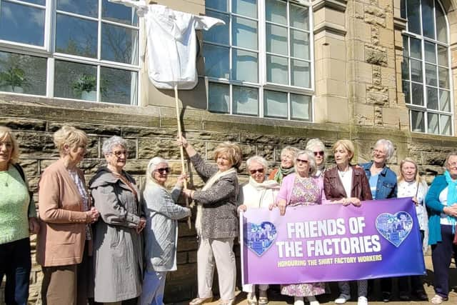 Former Factory Girls preparing to reveal the new plaque at the Star Factory.