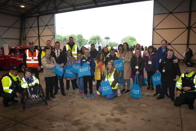 BEAR RUN 74. . . . .The Mayor, Graham Warke, organisers and parents, children and staff from Foyle Down Syndrome Trust pictured receiving goodie bags from Marissa McGilligan, City of Derry Airport during Saturdayâ€TMs Bear Run 74 VIP event at the airport. (Photos: Jim McCafferty Photography)