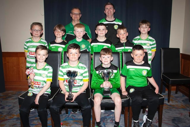 Top of the Hill Celtic U10 Winter Cup winners. Included are coaches Brendan Elliott and Martin Doherty. Picture by Jim McCafferty