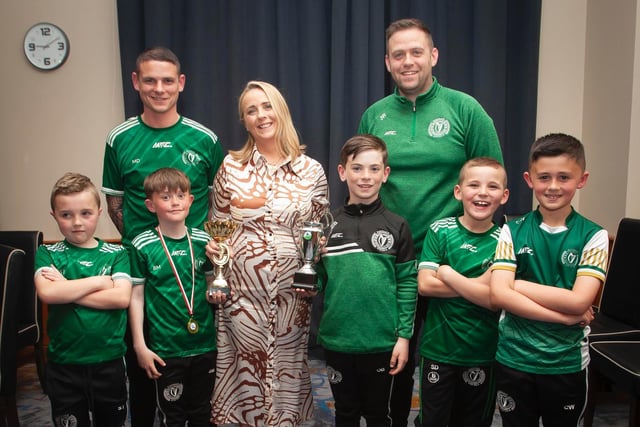 Caroline Casey, O'Neill's Sportswear presenting the U8 Winter Cup and Summer Cup to Foyle Harps at Thursday night's D&D awards. At back are coaches Mickey Deery and Jonny Ward. Picture by Jim McCafferty