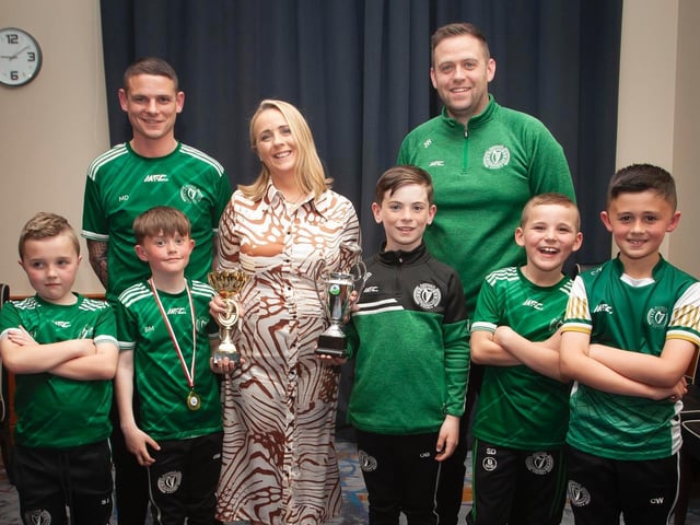 Caroline Casey, O'Neill's Sportswear presenting the U8 Winter Cup and Summer Cup to Foyle Harps at Thursday night's D&D awards. At back are coaches Mickey Deery and Jonny Ward. Picture by Jim McCafferty