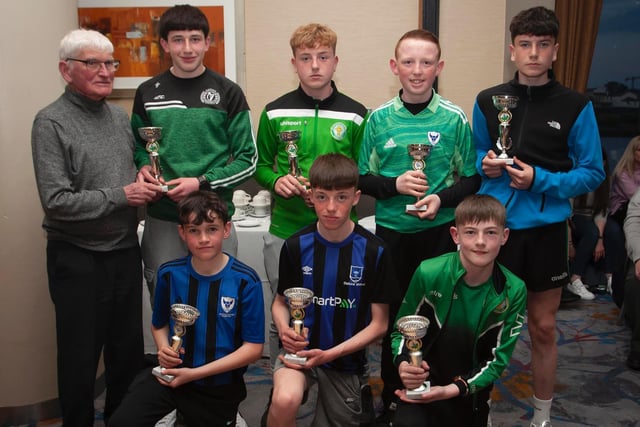 Jobby Crossan presenting trophies to some of the Players of the Years in various age groups at the D&D Annual Awards. Included are Jack Kirby, Foyle Harps; Peter Harkin, Top of the Hill Celtic; Liam Kelly, Oxford; Cole Smith, Oxford; Nyche McKenna, Oxford; Calum Downey, Oxford; and Taidhe Coyle, Top of the Hill Celtic. Picture by Jim McCafferty