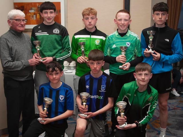 Jobby Crossan presenting trophies to some of the Players of the Years in various age groups at the D&D Annual Awards. Included are Jack Kirby, Foyle Harps; Peter Harkin, Top of the Hill Celtic; Liam Kelly, Oxford; Cole Smith, Oxford; Nyche McKenna, Oxford; Calum Downey, Oxford; and Taidhe Coyle, Top of the Hill Celtic. Picture by Jim McCafferty