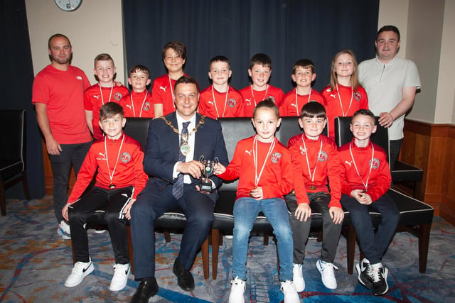 The Mayor, Graham Warke presenting Newell Academy U10s with the Winter Cup at Thursday night's awards. At back are coaches Gavin Duffy and Darren Quigley. Picture by Jim McCafferty