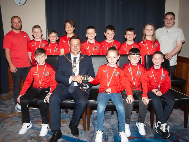 The Mayor, Graham Warke presenting Newell Academy U10s with the Winter Cup at Thursday night's awards. At back are coaches Gavin Duffy and Darren Quigley. Picture by Jim McCafferty