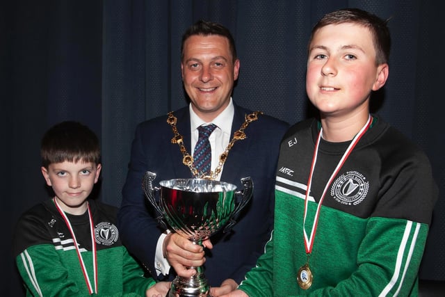 The Mayor, Graham Warke presenting Corey McCauley and Evan Jennings with the Willie Curran Cup at Thursday night's D&D Youth awards. Picture by Jim McCafferty