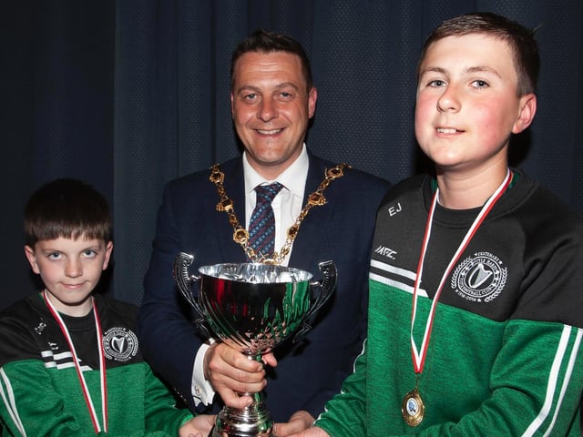 The Mayor, Graham Warke presenting Corey McCauley and Evan Jennings with the Willie Curran Cup at Thursday night's D&D Youth awards. Picture by Jim McCafferty