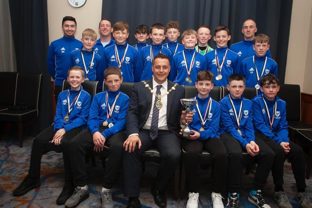 The Mayor, Graham Warke presenting Oxford United Stars FC U12 with the Winter Cup at Thursday night's awards. At back are coaches Stephen Harley, Darren Smyth and Tony Black. Picture by Jim McCafferty
