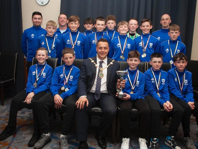 The Mayor, Graham Warke presenting Oxford United Stars FC U12 with the Winter Cup at Thursday night's awards. At back are coaches Stephen Harley, Darren Smyth and Tony Black. Picture by Jim McCafferty