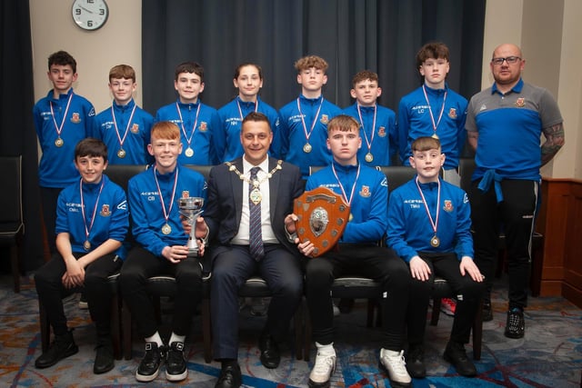 The Mayor, Graham Warke presenting Limavady Youths U13s with the League Trophy and League Cup at Thursday night's awards. At the back is coach Ryan Moore. Picture by Jim McCafferty