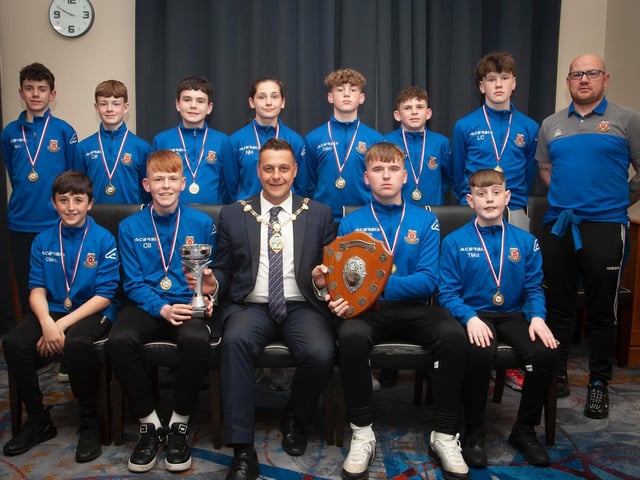 The Mayor, Graham Warke presenting Limavady Youths U13s with the League Trophy and League Cup at Thursday night's awards. At the back is coach Ryan Moore. Picture by Jim McCafferty