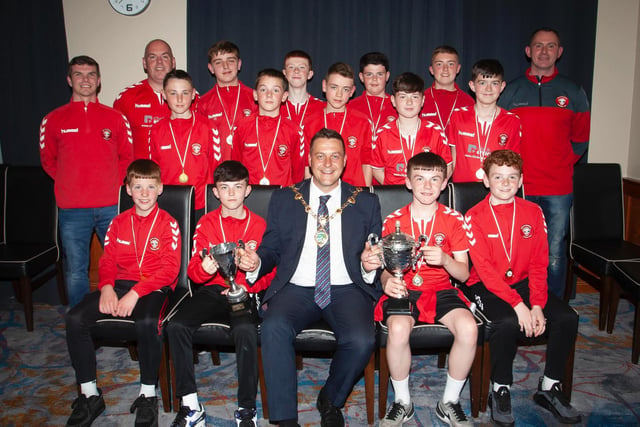 The Mayor, Graham Warke presenting Tristar U12s with the league trophy and Summer Cup at Thursday night's awards. At back are coaches Vinnie Morrison, Sean Curran and Jim Kearney. Picture by Jim McCafferty
