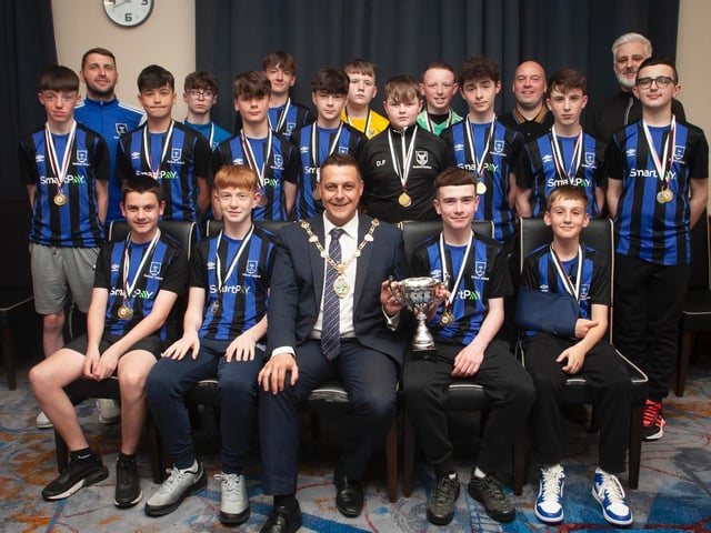 The Mayor, Graham Warke presenting Oxford United Stars FC U14s with the Winter Cup at Thursday night's awards. Oxford also won the National League and were D&D League runners-up. At back are coaches Ronan Kelly, Shaun Heaney and Raymond McDermott. Picture by Jim McCafferty